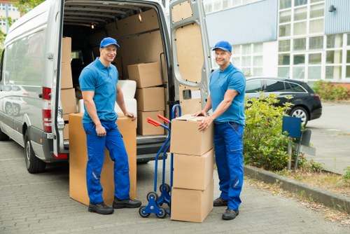 Professional movers loading a van for a Honoroak home relocation