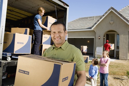 Packed household boxes and moving supplies in Honoroak